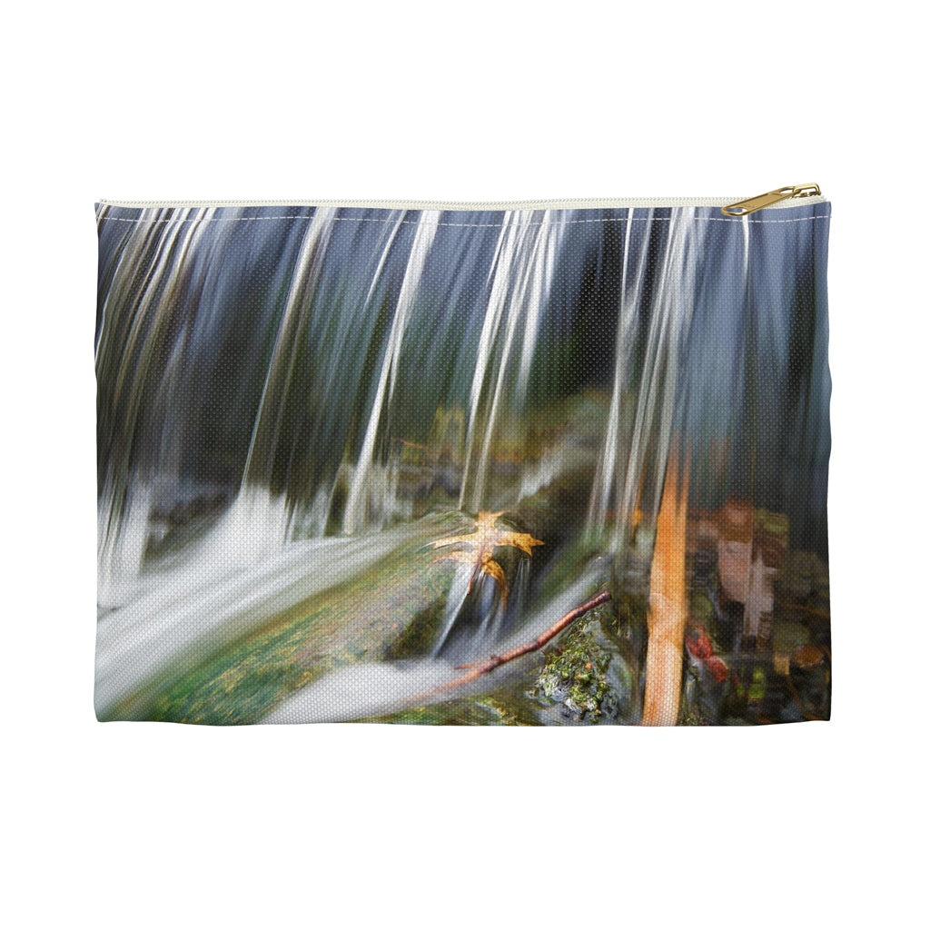 Front view of the small 8.5 x 6 inch pouch with creek waterfall design and white zipper.