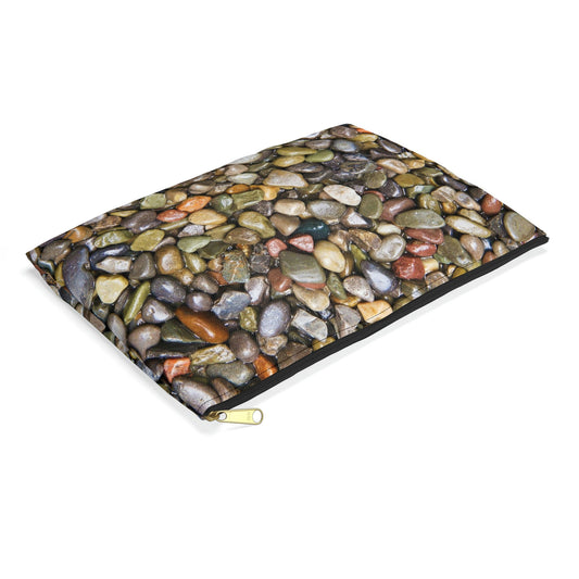 Small pouch with pebbles and stones design lying flat, showcasing the slim profile feature.