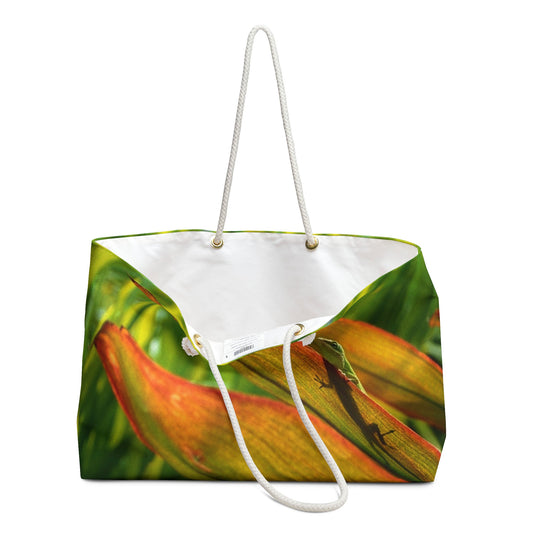An open view of the beach bag with sunlit gecko design shows the cream colored interior lining.