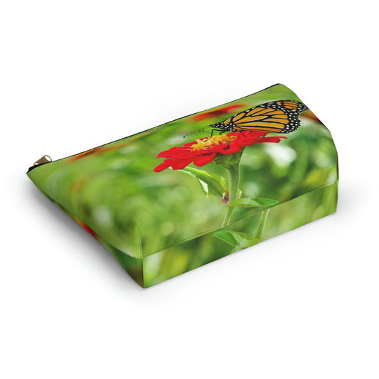 Bottom view of the kit bag with butterfly on flower design angled to showcase the depth and all over print design.