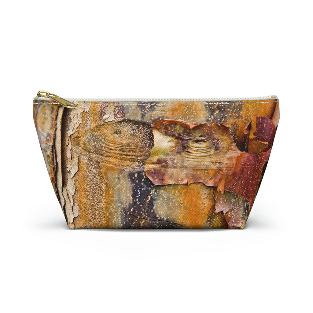 Front view of the small 8.75 x 4.75 x 2.25 inch kit bag with orange bark design and white zipper.