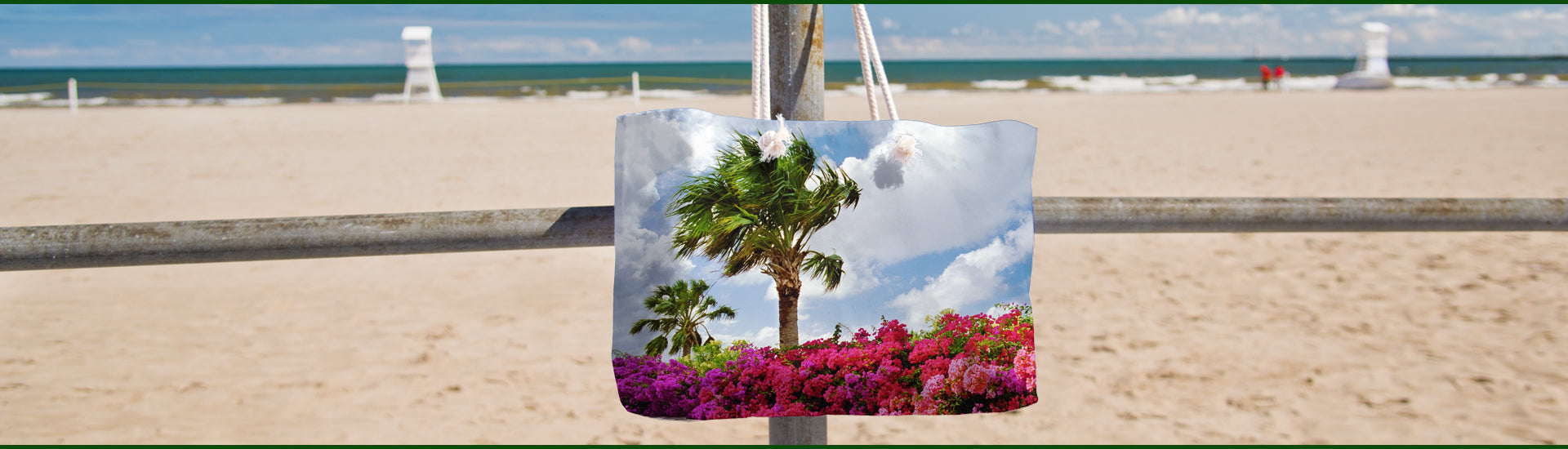 Tropical Splash beach bag hanging on a post at the beach.