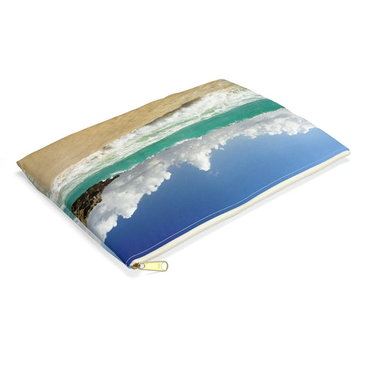 Small pouch with crashing waves design lying flat, showcasing the slim profile feature.