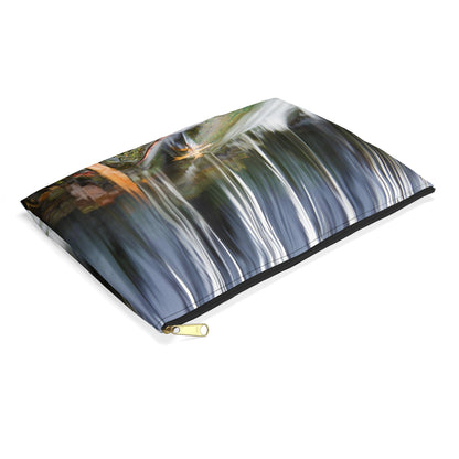 Small pouch with creek waterfall design lying flat, showcasing the slim profile feature.