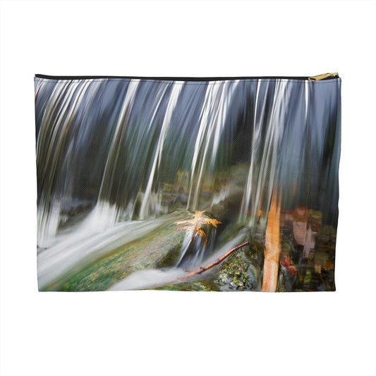 Zippered accessory pouch featuring vibrant photo art of a swift creek waterfall striking fall colored leaves in the rock bed.