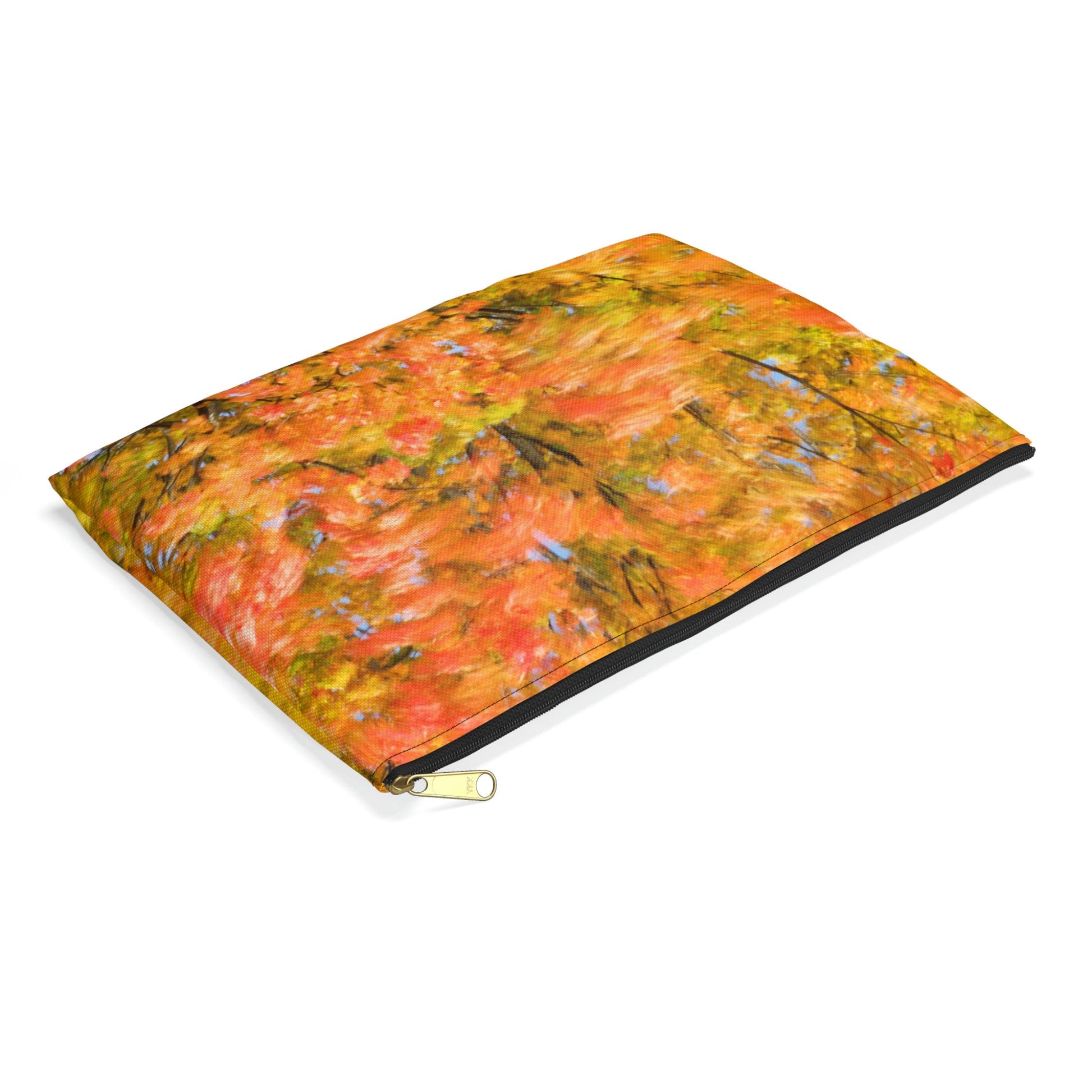 Small pouch with fall colored trees design lying flat, showcasing the slim profile feature.