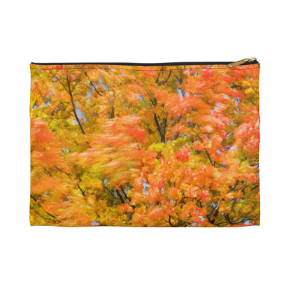 Front view of the small 8.5 x 6 inch pouch with fall colored trees design and black zipper.