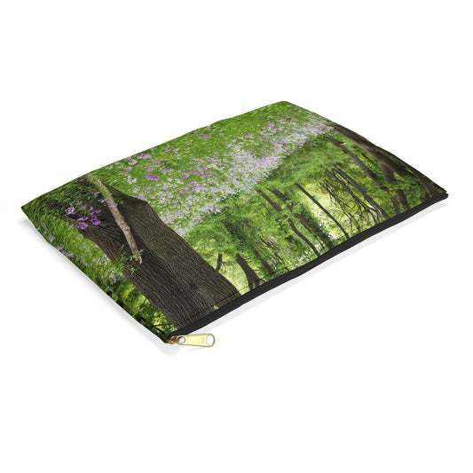 Small pouch with forest wildflowers design lying flat, showcasing the slim profile feature.
