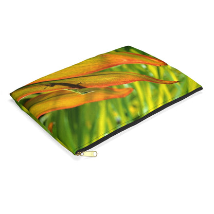 Small pouch with sunlit gecko design lying flat, showcasing the slim profile feature.