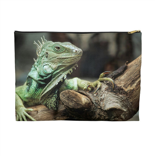 Zippered accessory pouch featuring vibrant photo art close up of a regal looking green iguana perched on a thick branch.