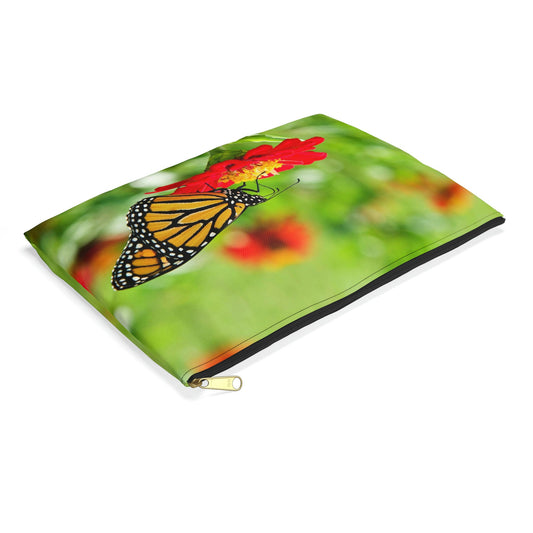 Small pouch with butterfly on flower design lying flat, showcasing the slim profile feature.