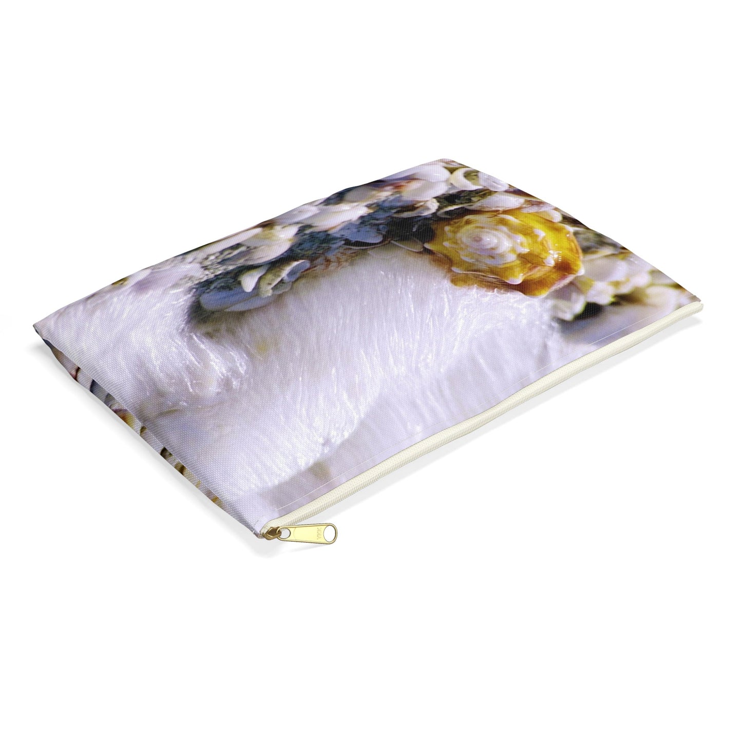Small pouch with shell in surf design lying flat, showcasing the slim profile feature.