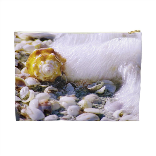 Zippered accessory pouch featuring vibrant photo art close up of a shell about to be swept up by a crashing wave.