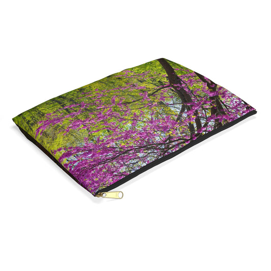 Small pouch with tree blossoms design lying flat, showcasing the slim profile feature.