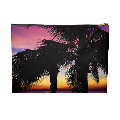 Zippered accessory pouch featuring vibrant photo art of intense multi colored sunset with black palm trees in the foreground.