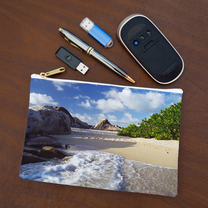 Small pouch with beach surf design lying flat on desktop with thumb drives, computer mouse and pen.