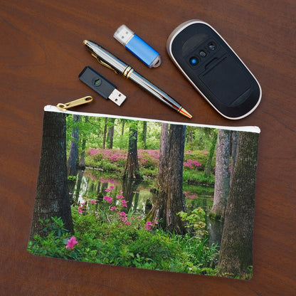 Small pouch with wetland design lying flat on desktop with thumb drives, computer mouse and pen.