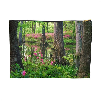 Zippered accessory pouch featuring vibrant photo art of lush green trees and hot pink colored flowers in a South Carolina wetland.