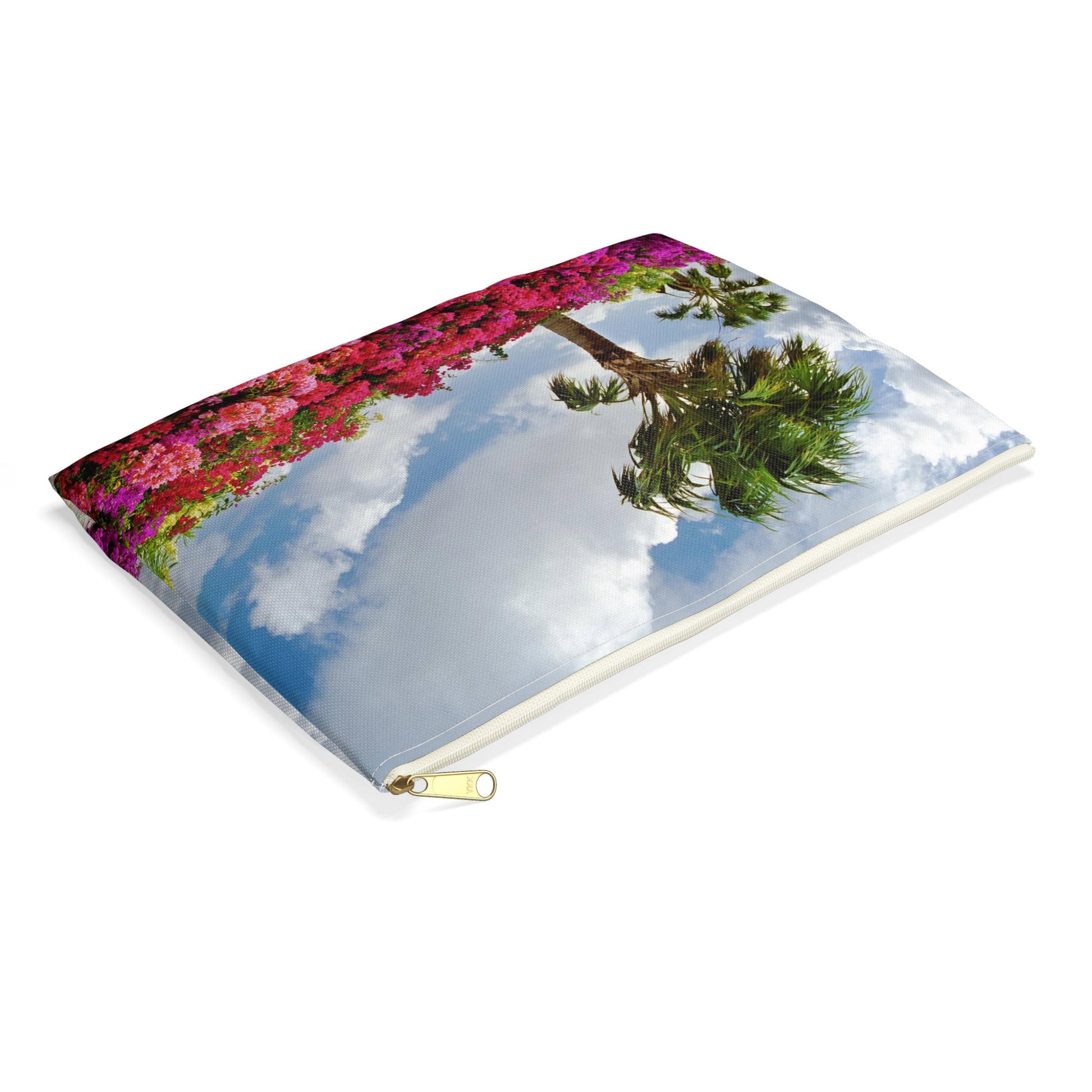 Small pouch with tropical flowers design lying flat, showcasing the slim profile feature.