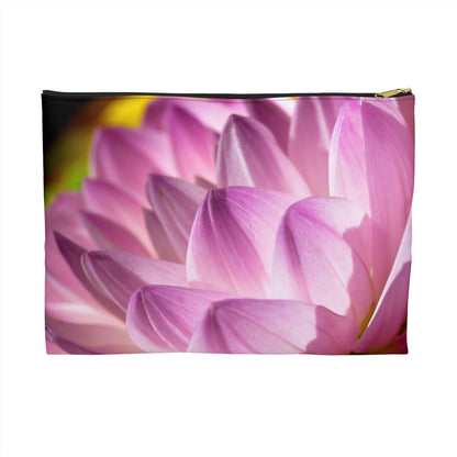 Zippered accessory pouch featuring a vibrant photo art close up of pinkish violet colored flower petals in warm sunset light.