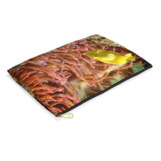 Small pouch with yellow fish design lying flat, showcasing the slim profile feature.