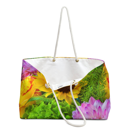 An open view of the beach bag with flower bouquet design shows the cream colored interior lining.