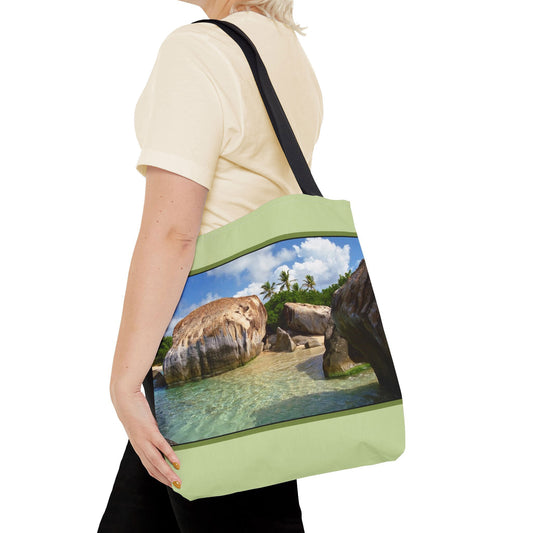 Young woman with a tote bag featuring the calm turquoise water design draped across her shoulder.