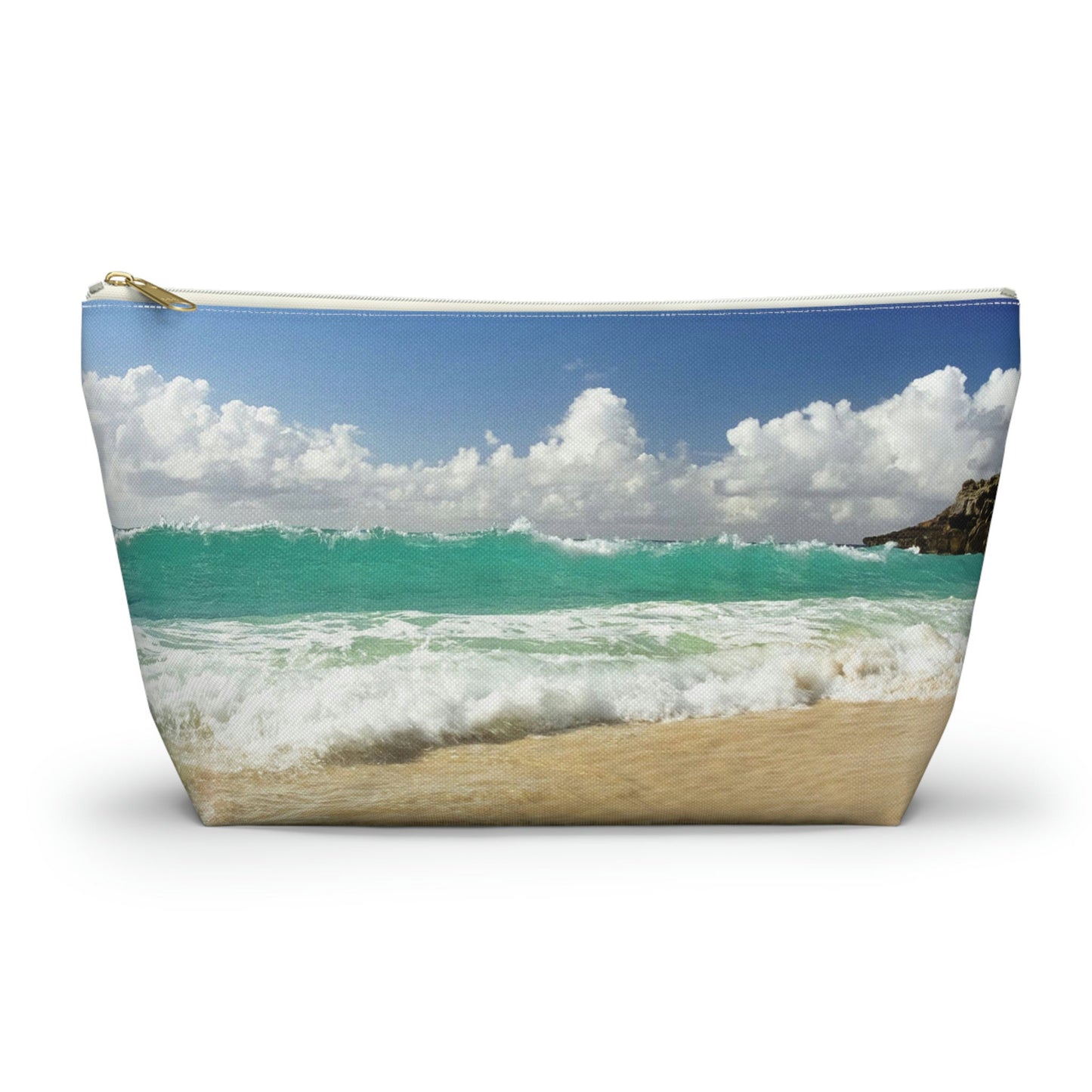 Zippered accessory pouch featuring vibrant photo art of a vast turquoise Caribbean wave cresting about to crash on the beach. 
