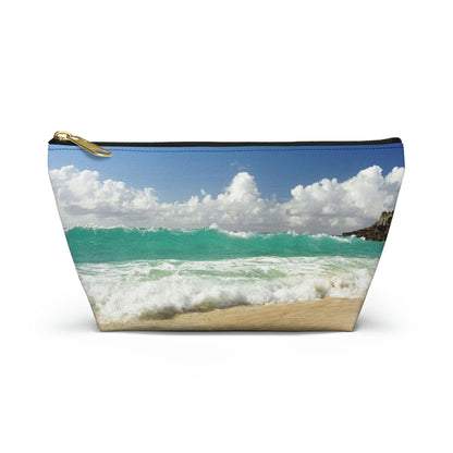 Front view of the small 8.75 x 4.75 x 2.25 inch kit bag with crashing waves design and black zipper.