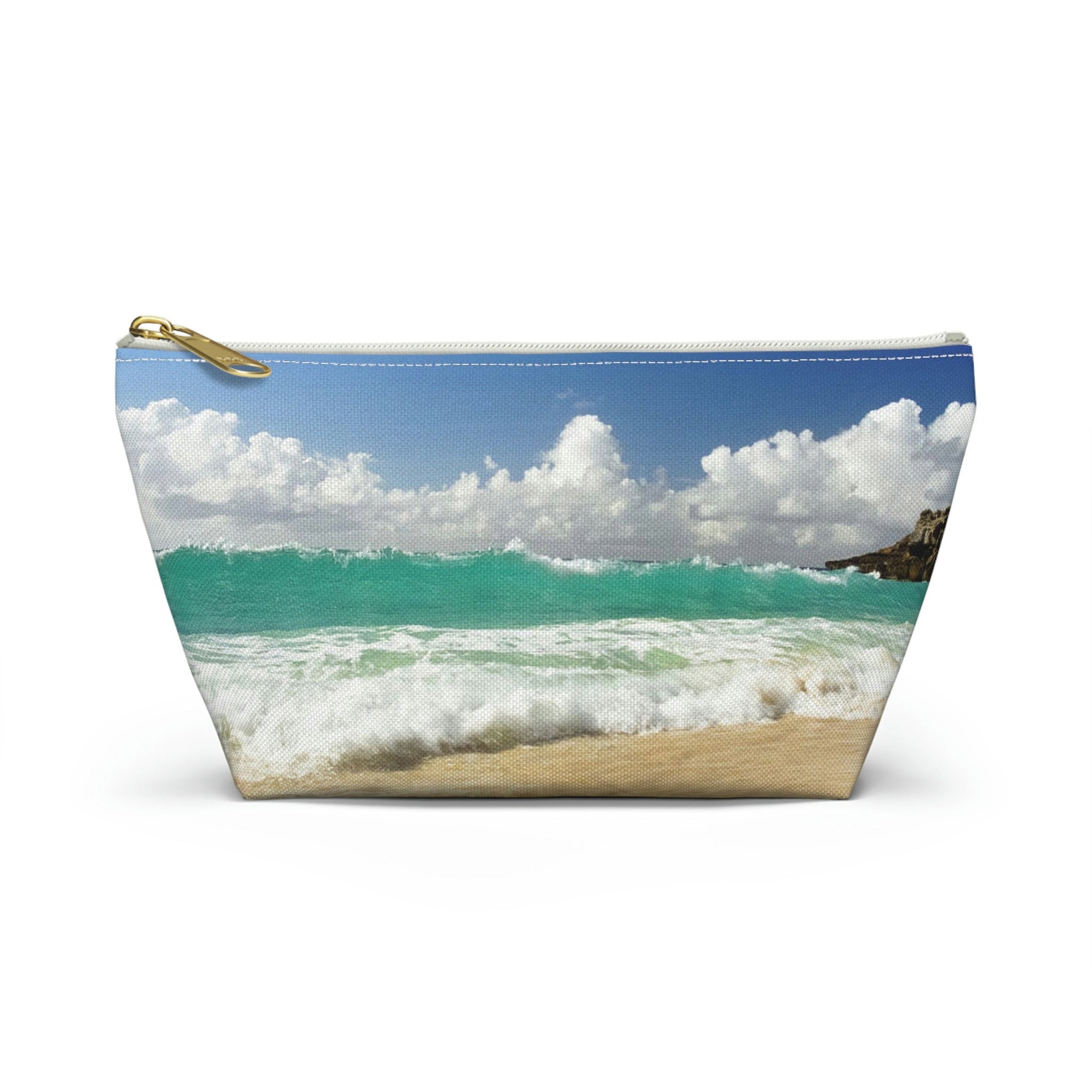 Front view of the small 8.75 x 4.75 x 2.25 inch kit bag with crashing waves design and white zipper.