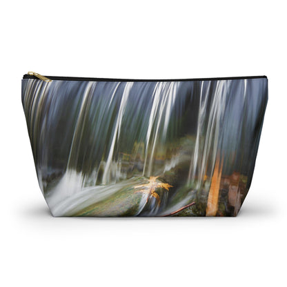 Zippered accessory pouch featuring vibrant photo art of a swift creek waterfall striking fall colored leaves in the rock bed. 