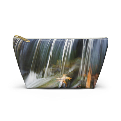 Front view of the small 8.75 x 4.75 x 2.25 inch kit bag with creek waterfall design and white zipper.