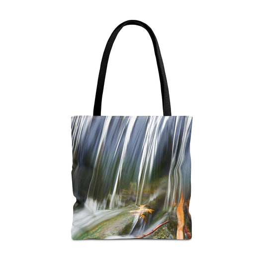 Large 18 x 18 inch tote bag featuring vibrant photo art of a swift creek waterfall striking fall leaves in the rock bed.