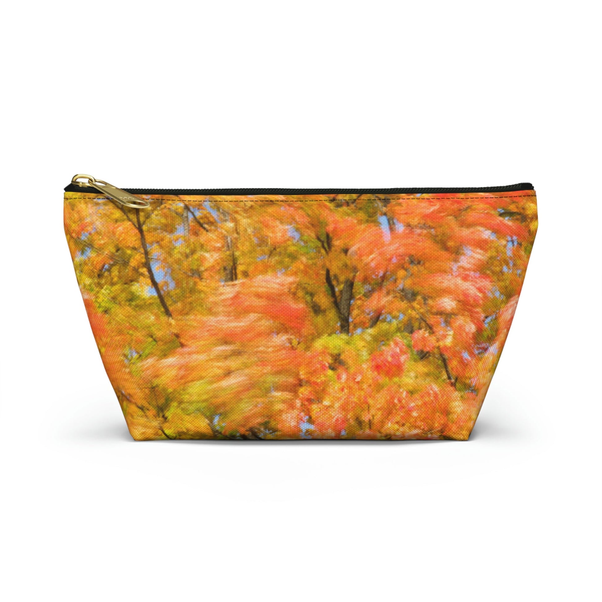 Front view of the small 8.75 x 4.75 x 2.25 inch kit bag with fall colored trees design and black zipper.