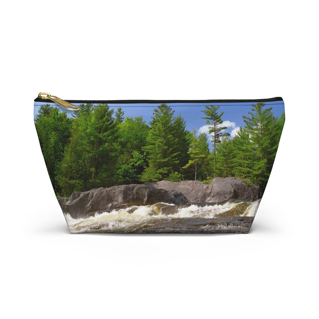 Front view of the small 8.75 x 4.75 x 2.25 inch kit bag with forest waterfall design and black zipper.