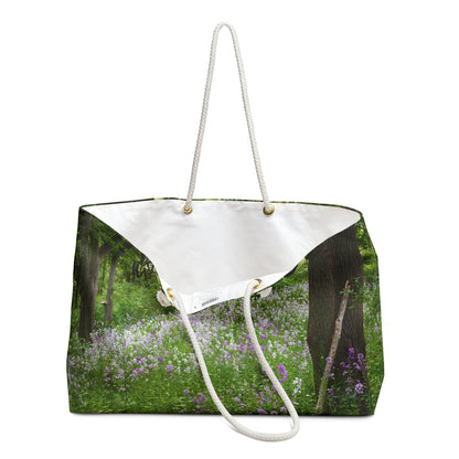 An open view of the beach bag with forest wildflowers design shows the cream colored interior lining.