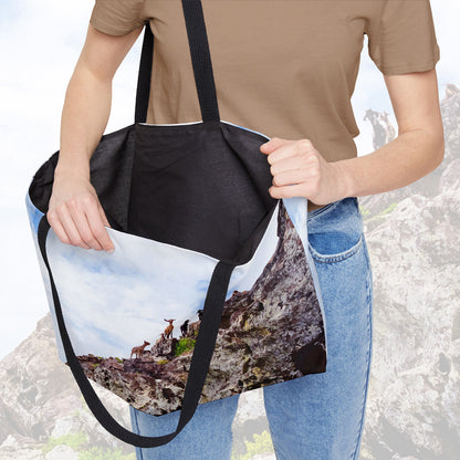 A woman holding open a weekender bag featuring the curious goats design, showcasing the roomy interior.