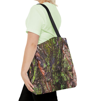 Young woman with a tote bag featuring the green mossy bark design draped across her shoulder.