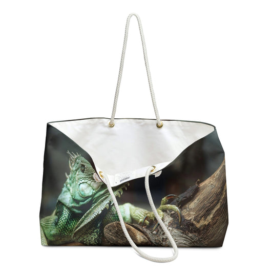 An open view of the beach bag with green iguana design shows the cream colored interior lining.