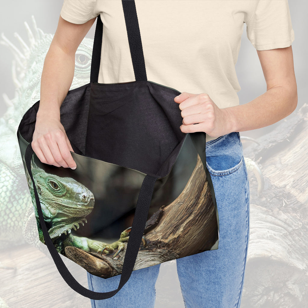 A woman holding open a weekender bag featuring the green iguana design, showcasing the roomy interior.