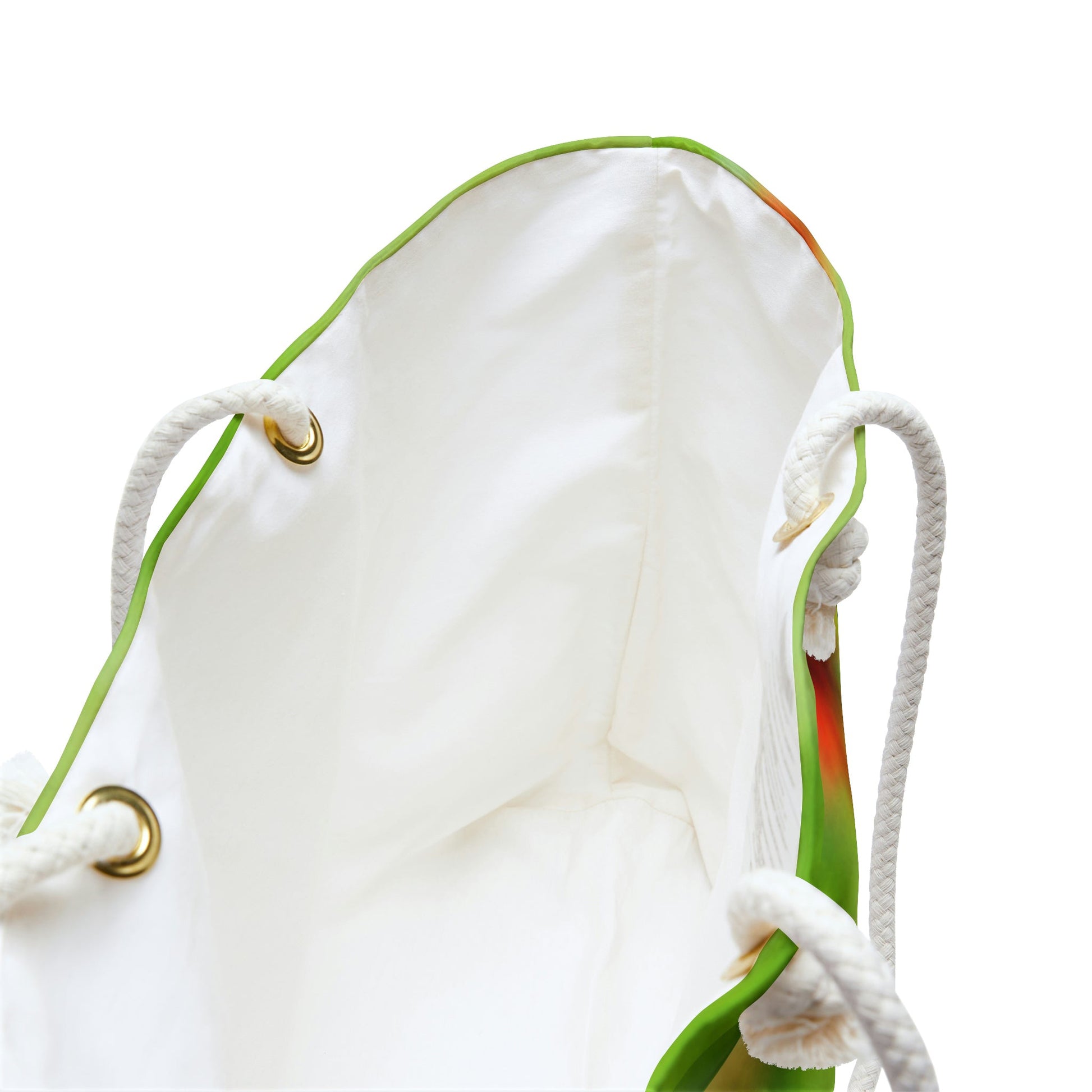 A close up view of the beach bag with butterfly on flower design shows the braided rope handles with metal grommets.
