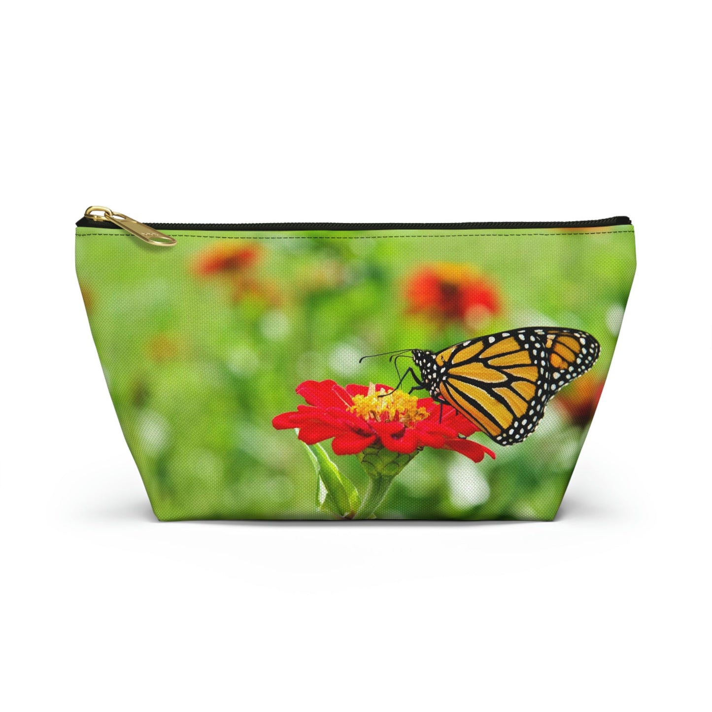 Front view of the small 8.75 x 4.75 x 2.25 inch kit bag with butterfly on flower design and black zipper.