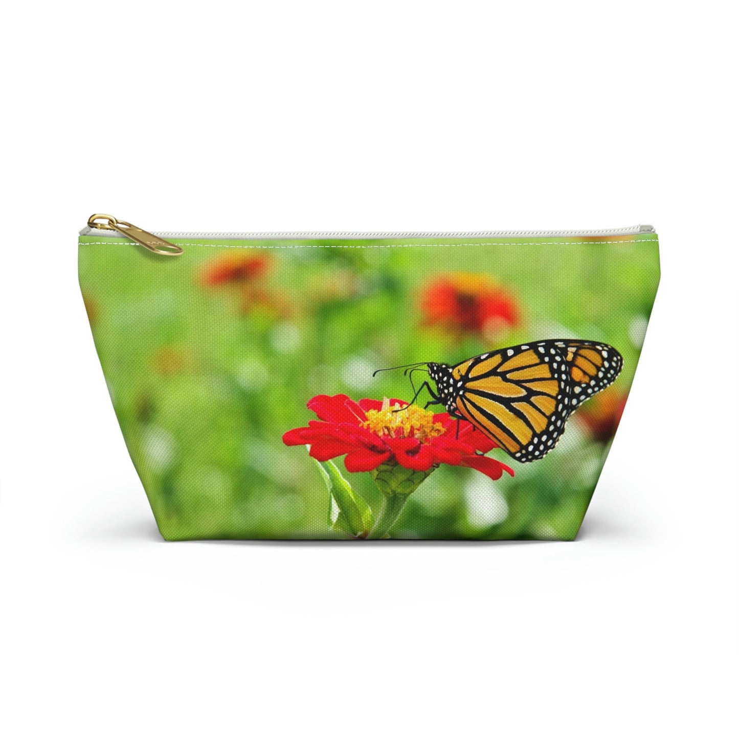 Front view of the small 8.75 x 4.75 x 2.25 inch kit bag with butterfly on flower design and white zipper.