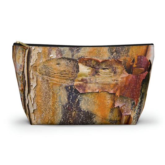 Zippered kit bag featuring vibrant photo art close up of orange tree bark with eyes and sly smile facial features.