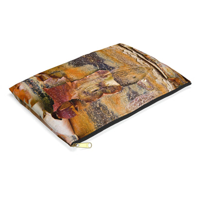 Small pouch with orange bark design lying flat, showcasing the slim profile feature.