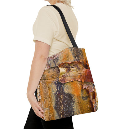 Young woman with a tote bag featuring the orange bark design draped across her shoulder.