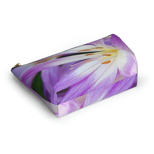Bottom view of the kit bag with purple flower, orange stamen design angled to showcase the depth and all over print design.
