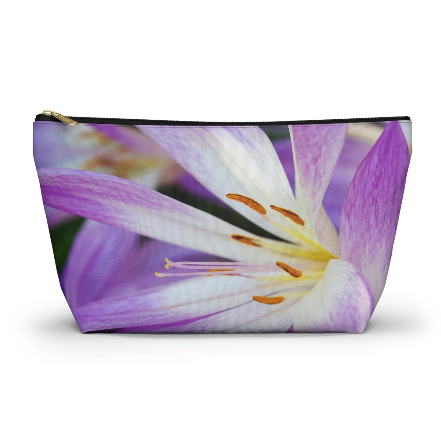 Zippered accessory pouch featuring vibrant photo art close up of purple and white flower petals with orange stamen.