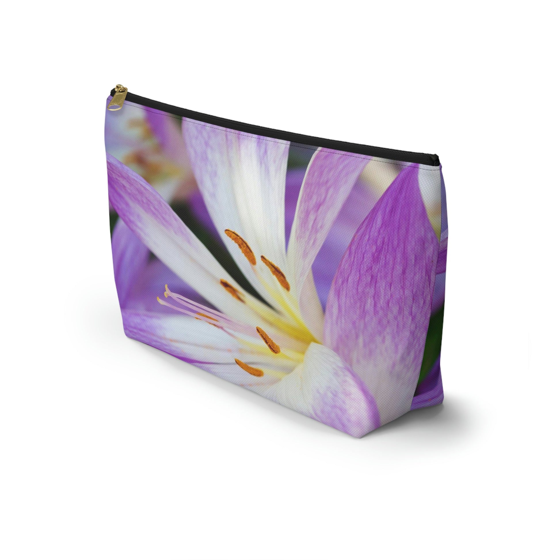 Front view of the kit bag with purple flower, orange stamen design angled to showcase the depth and all over print design.
