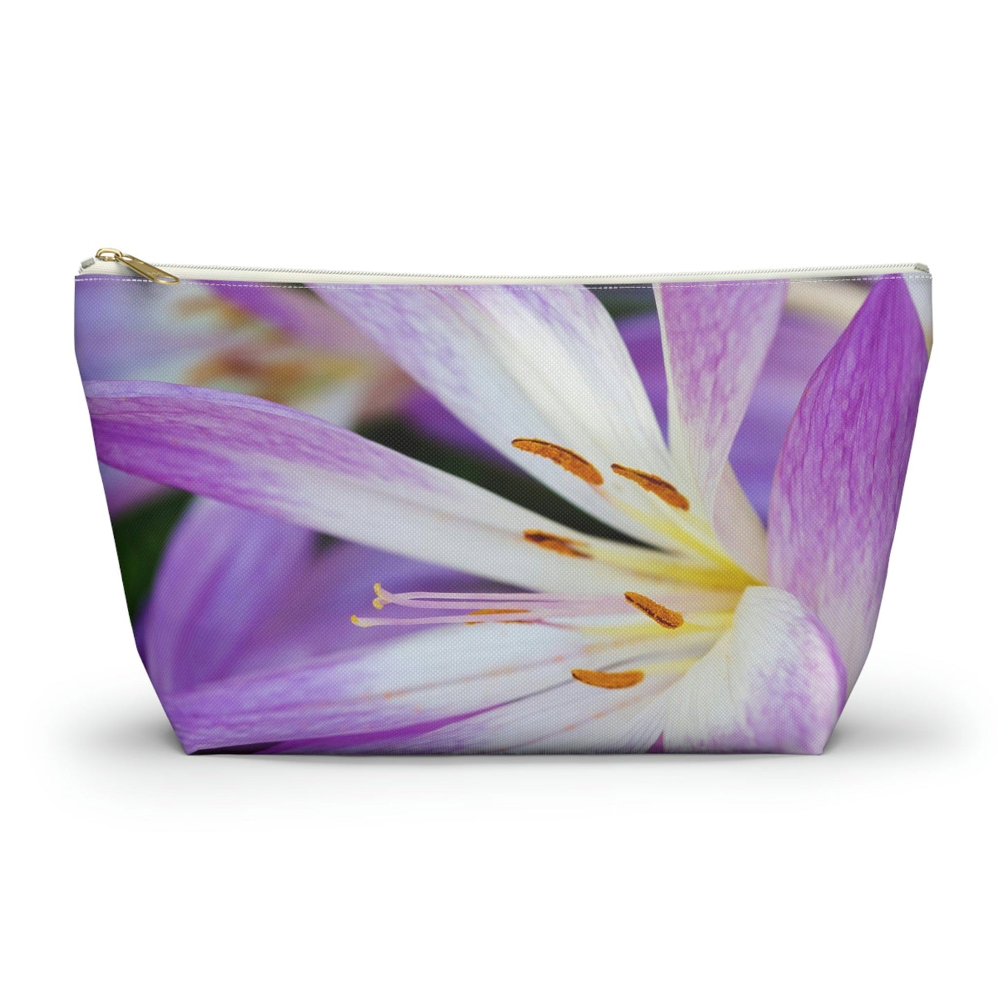 Front view of the large 12.5 x 7.25 x 3.25 inch kit bag with purple flower, orange stamen design and white zipper.